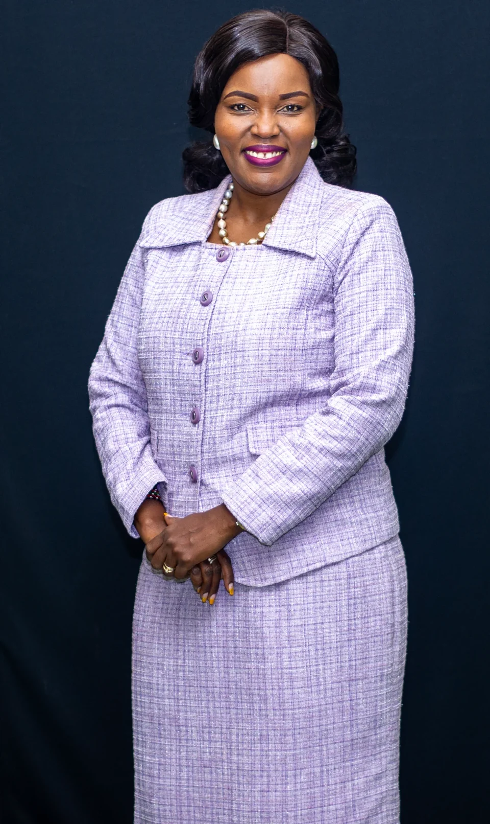 Rev. Dr. Joyce Kariuki in a lilac suit